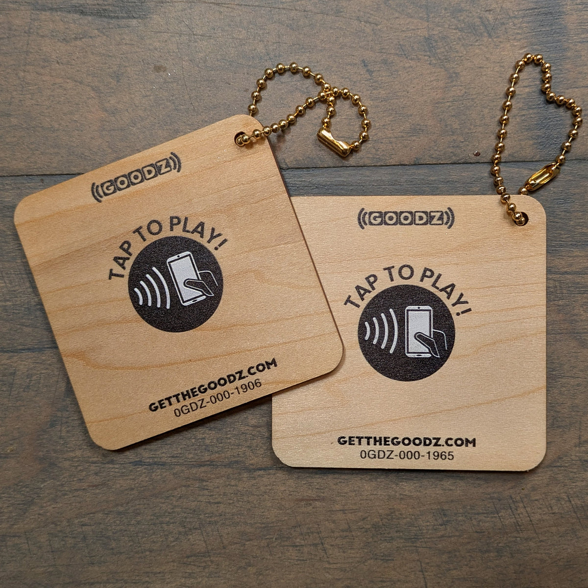 Back of two wooden Mixtape Goodz showing the Tap to Play NFC mark and getthegoodz.com